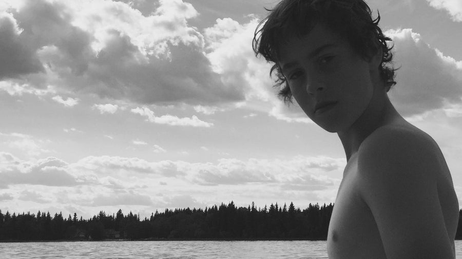 Young Aidan Anderson at Candle Lake, Saskatchewan — the lake an hour from home that shaped the meaning behind I Need To Ride.