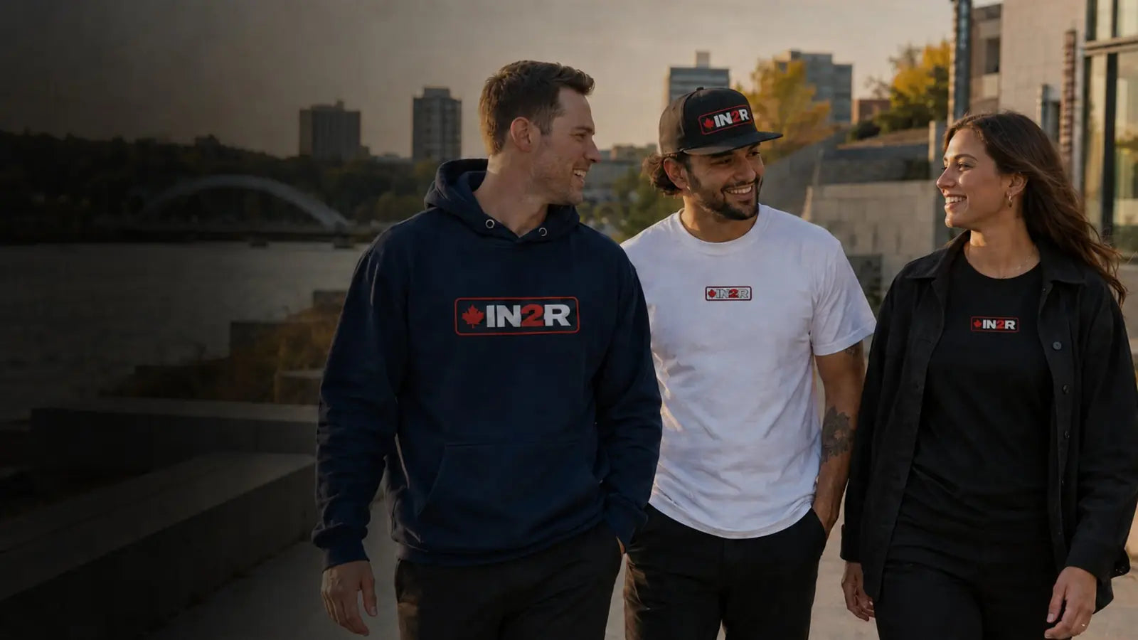 Models wearing embroidered IN2R Canadian Edition hoodie, tee and snapback