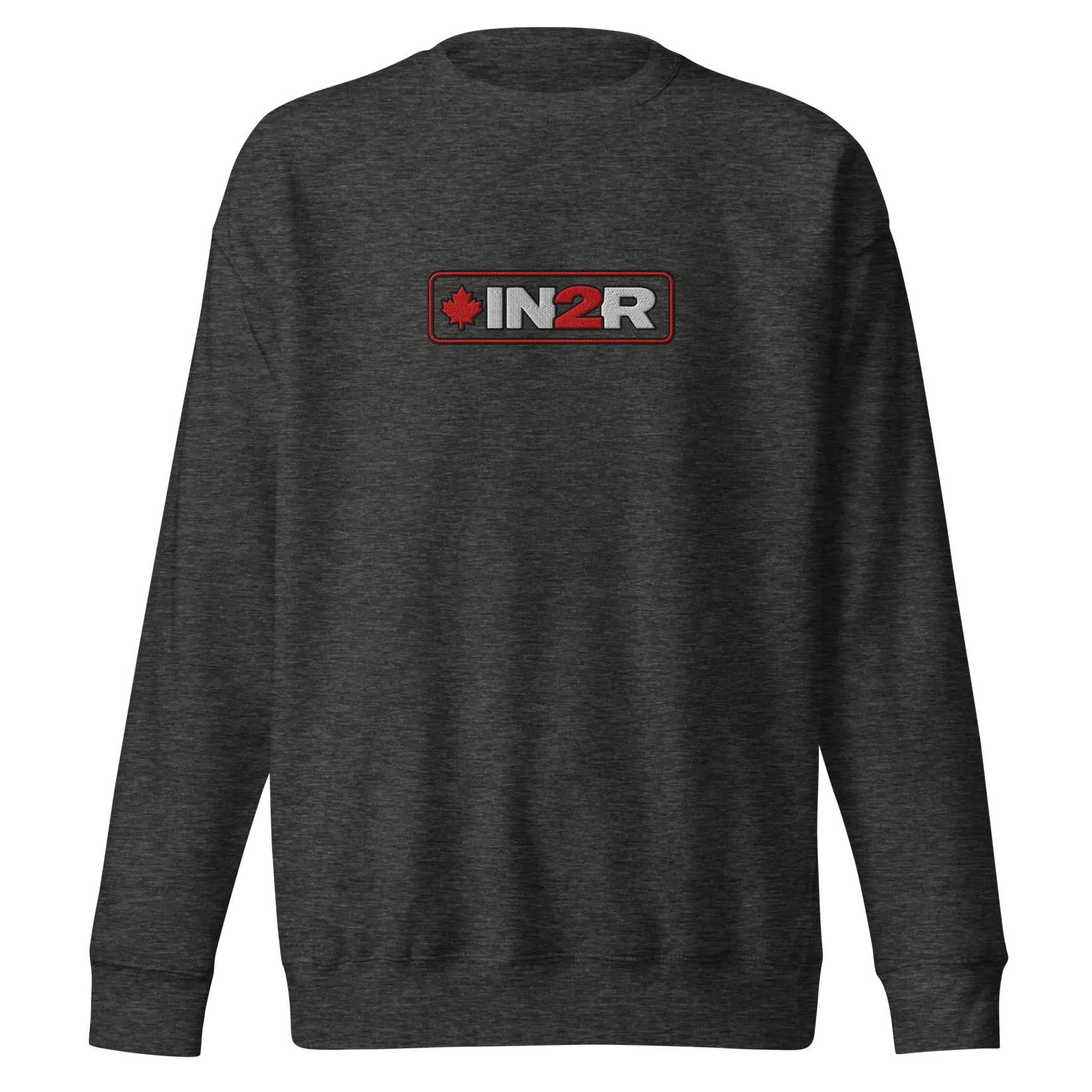 A dark heather gray crewneck sweatshirt featuring a rectangular chest graphic with the text 'IN2R' in white and red, flanked by a red maple leaf icon, set against a plain white background.