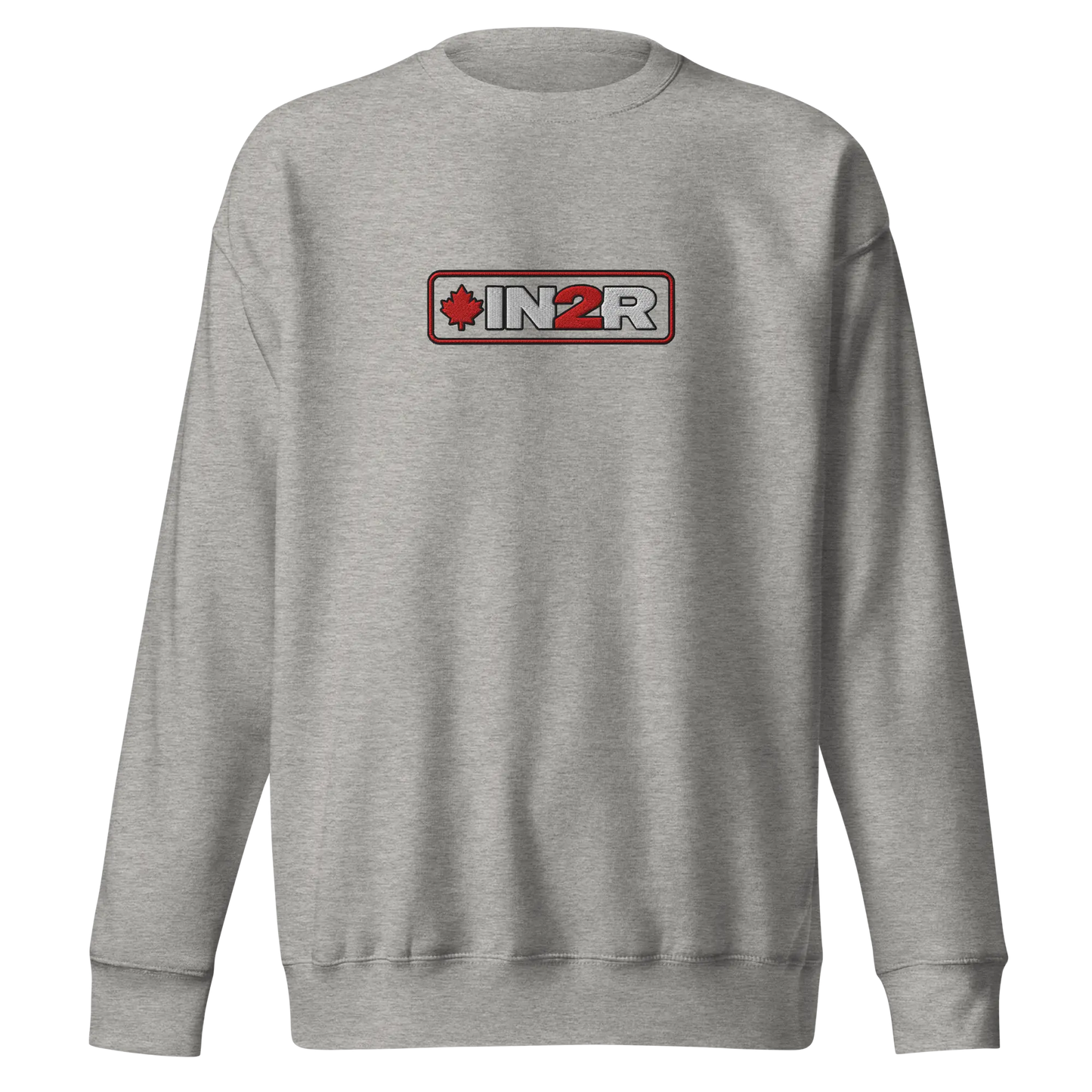 A carbon gray crewneck sweatshirt featuring a rectangular chest graphic with the text 'IN2R' in white and red, flanked by a red maple leaf icon, set against a plain white background.