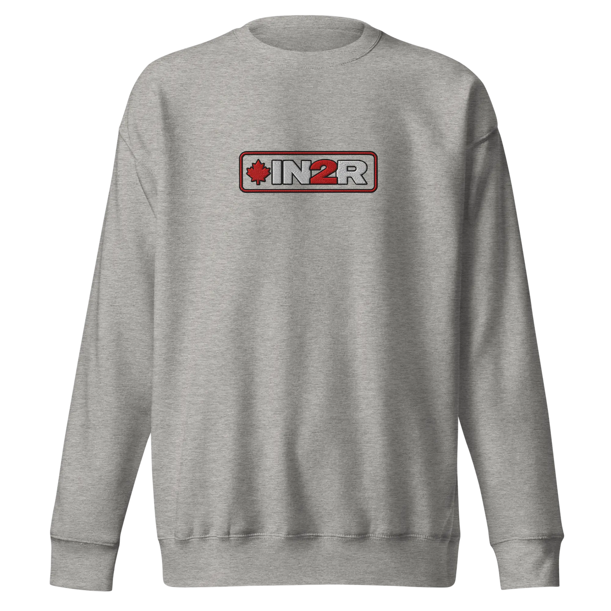 A carbon gray crewneck sweatshirt featuring a rectangular chest graphic with the text 'IN2R' in white and red, flanked by a red maple leaf icon, set against a plain white background.