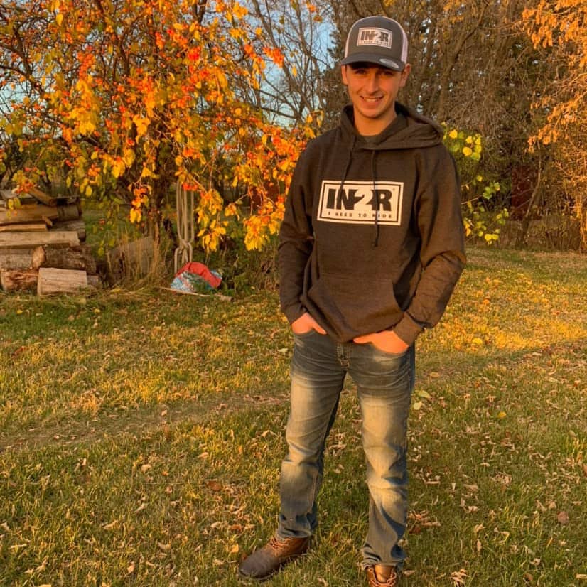 Declan Trudel wearing an IN2R Original hoodie and trucker hat outdoors