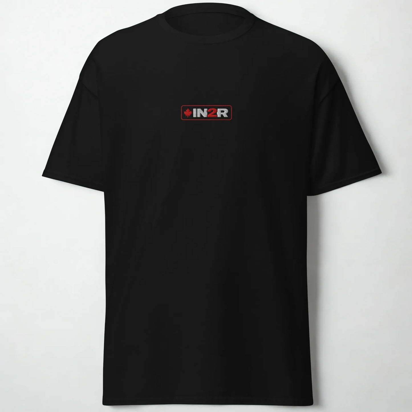 A black short-sleeve crewneck t-shirt with a small rectangular IN2R logo printed on the center chest, displayed against a light gray background.