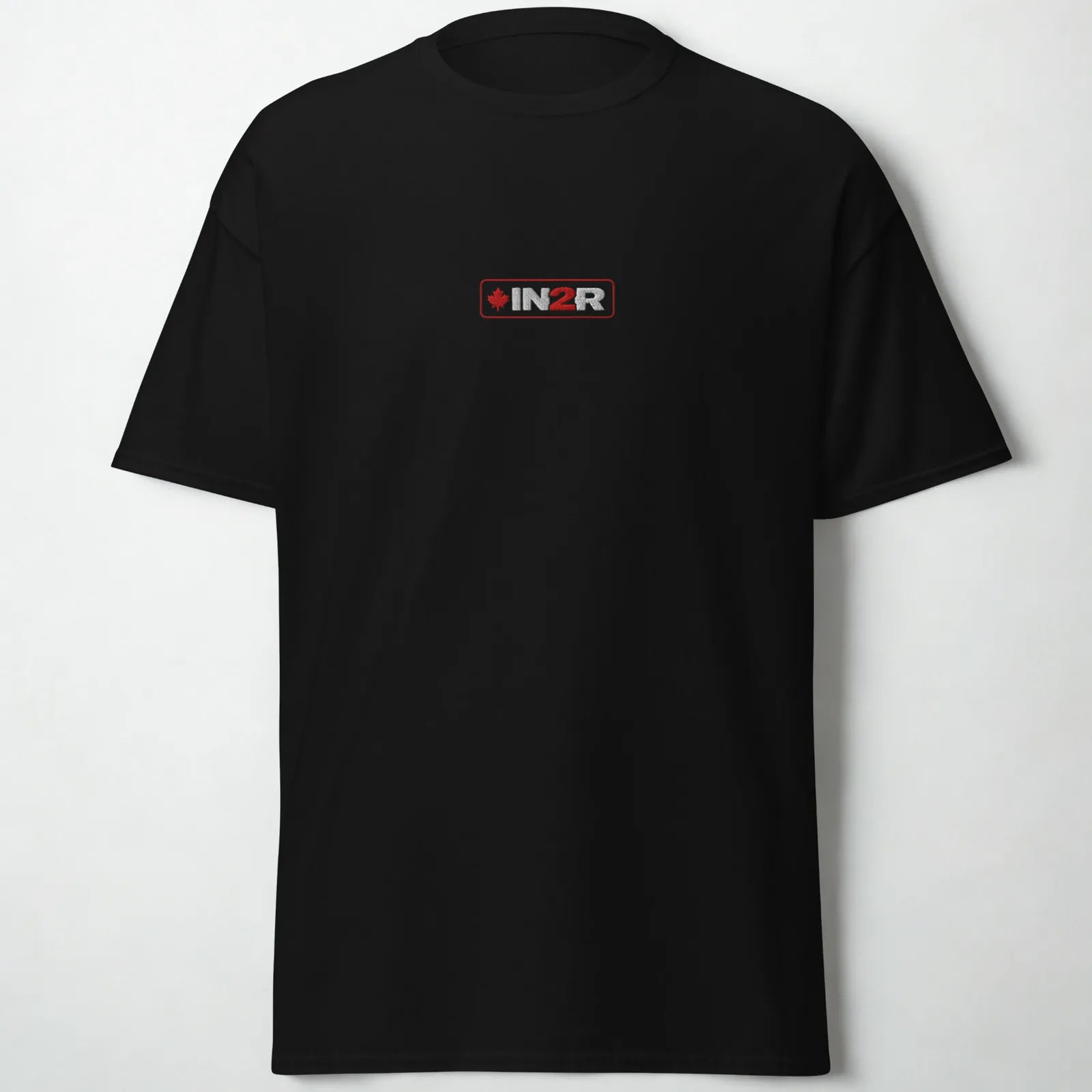 A black short-sleeve crewneck t-shirt with a small rectangular IN2R logo printed on the center chest, displayed against a light gray background.