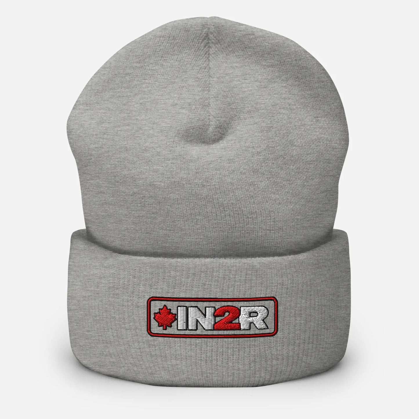 A light gray heather knit beanie with a folded cuff, featuring a rectangular embroidered patch on the front with the text 'IN2R' in white and a red maple leaf.