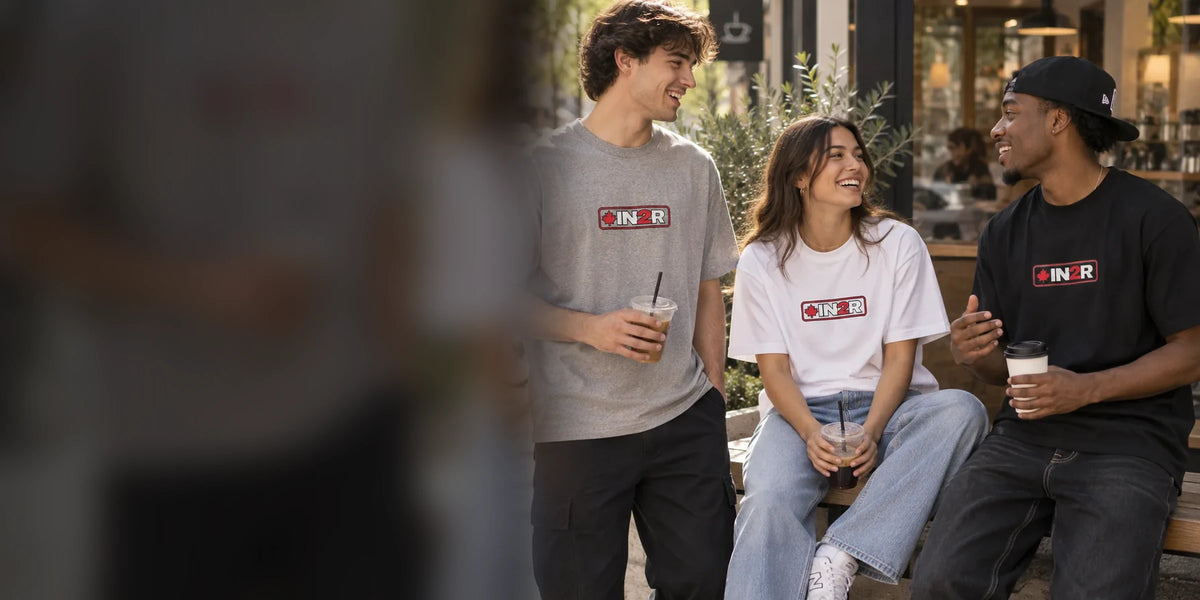 Models wearing IN2R Canadian Edition apparel in a modern Canadian setting