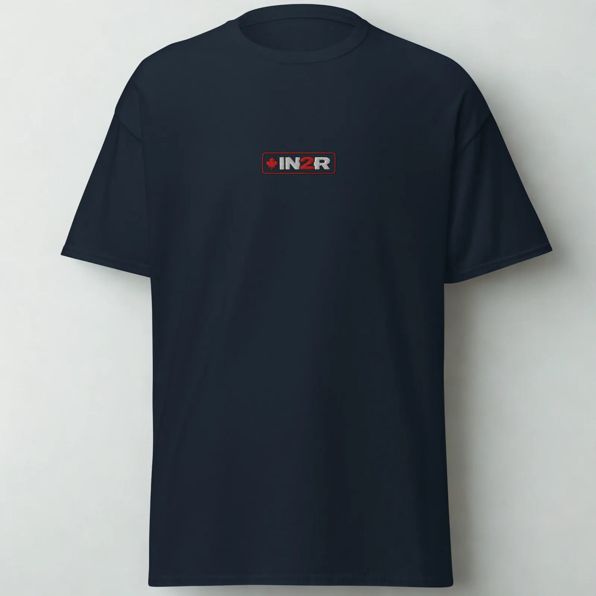 A dark navy blue short-sleeve crewneck t-shirt with a small rectangular chest logo that reads 'IN2R' in white and red, set against a plain light gray background.