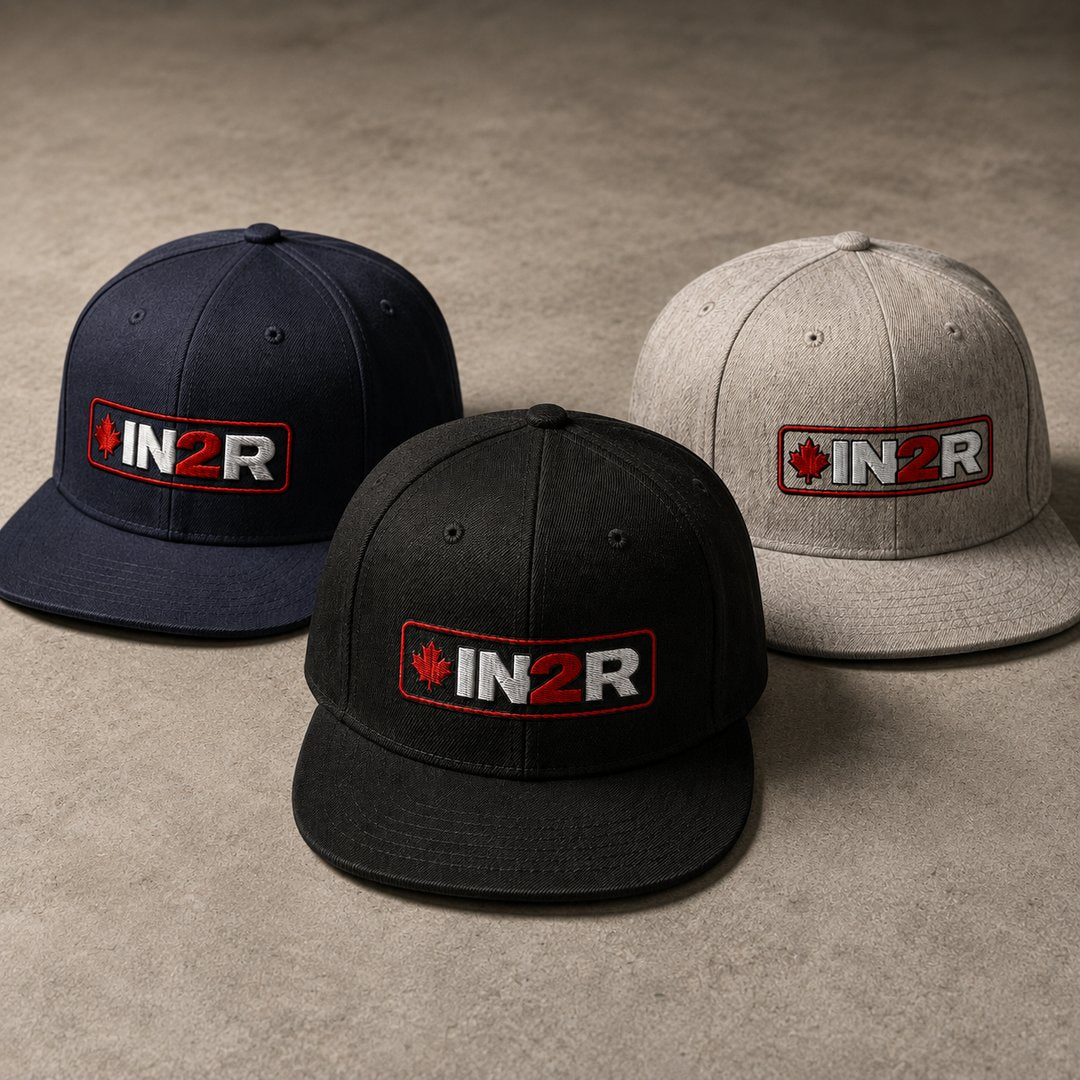 IN2R Canadian Edition snapback hats in navy, black and heather grey featuring embroidered red, white and black IN2R maple leaf logos.