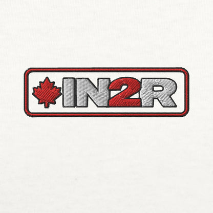 An embroidered patch featuring the text 'IN2R' in white and red with a red maple leaf on the left, all enclosed in a rounded red and white border, shown on a plain white background.