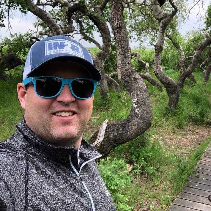 Chris May wearing an IN2R shirt outdoors