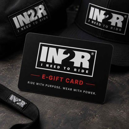 A black IN2R e-gift card with white and red text reading 'E-GIFT CARD' and 'RIDE WITH PURPOSE. WEAR WITH POWER.
