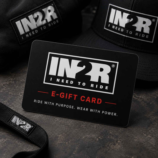 A black IN2R e-gift card with white and red text reading 'E-GIFT CARD' and 'RIDE WITH PURPOSE. WEAR WITH POWER.