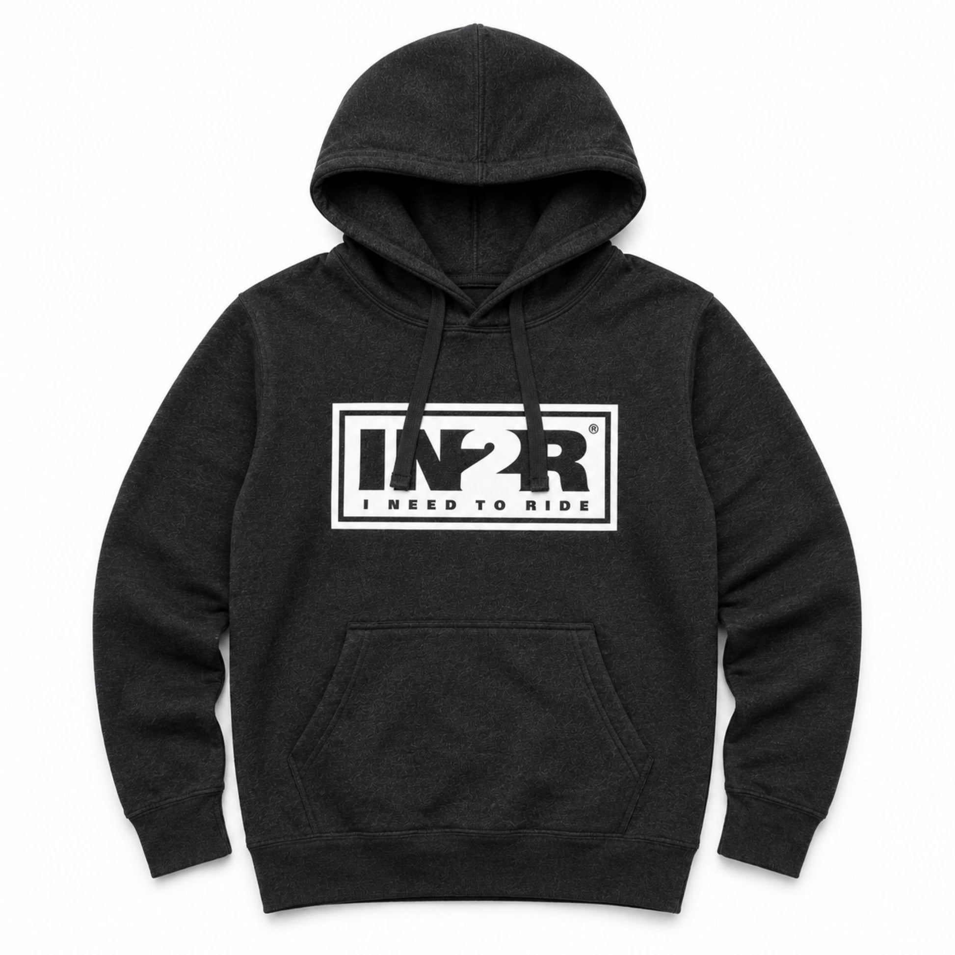 A dark charcoal gray heather pullover hoodie with a white rectangular chest graphic that reads 'IN2R I NEED TO RIDE'. The hoodie features a front kangaroo pocket and drawstring hood, shown against a plain white background.