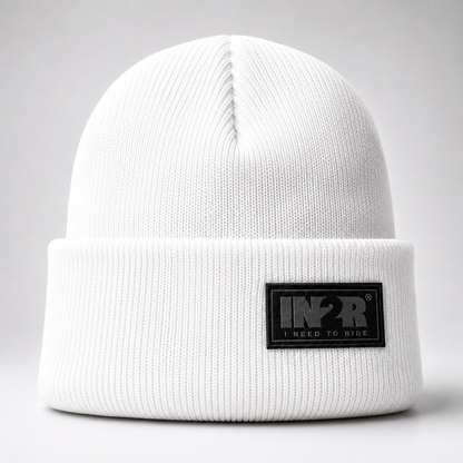 White IN2R Original Knit Beanie featuring a soft acrylic knit and signature woven logo patch.