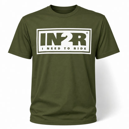A moss green short-sleeve t-shirt with a white graphic on the chest reading 'IN2R I NEED TO RIDE' inside a rectangular border.