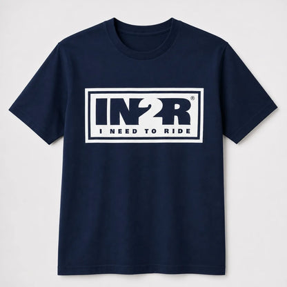A navy blue short-sleeve crewneck t-shirt with a white rectangular graphic on the chest featuring the stylized text 'IN2R' and 'I NEED TO RIDE'.