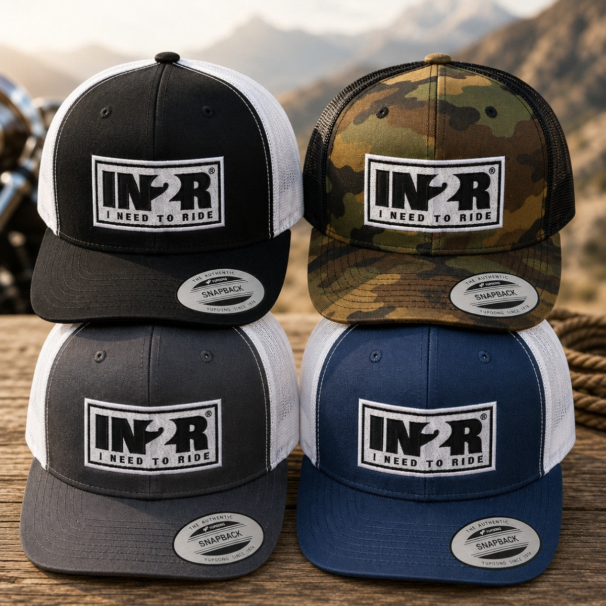 IN2R Original Trucker Snapback Hat collection featuring Black/White, Charcoal/White, Navy/White and Camo colour options with embroidered logo.